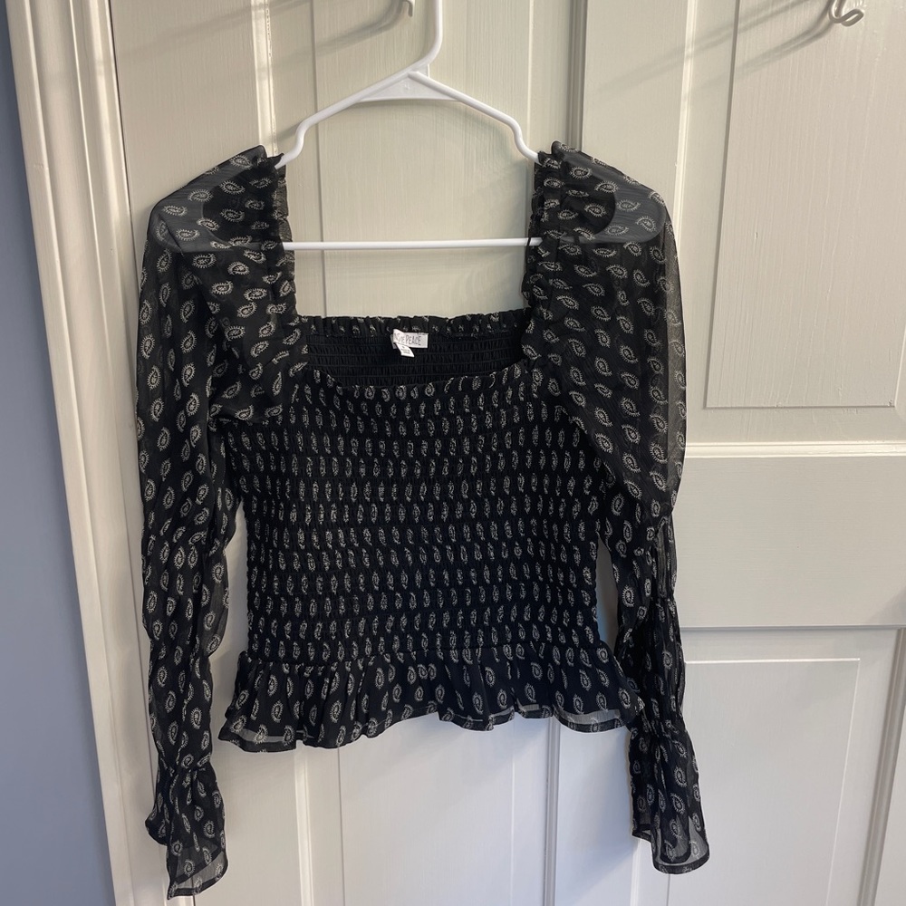 patrons of peace black long sleeve top with white paisley print